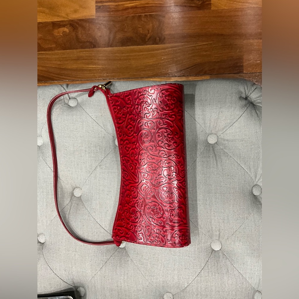 Tiffany and Fred red leather hand bag. Never carried. It is gorgeous